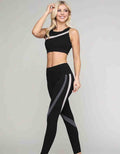 Curved Stripe Sports Bra in black with grey and white diagonal stripes, scoop neckline, cropped fit.
