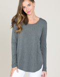 Model wearing a comfortable Heather Charcoal long sleeve round neck top made from soft modal fabric.