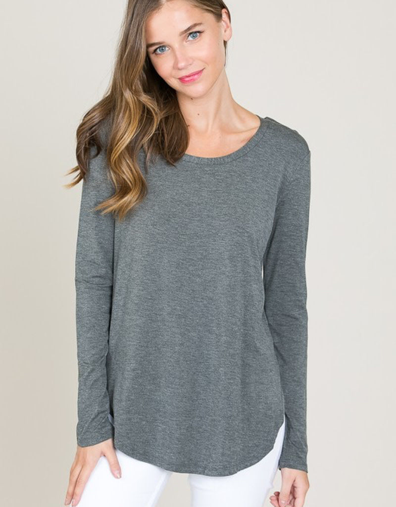 Model wearing a comfortable Heather Charcoal long sleeve round neck top made from soft modal fabric.