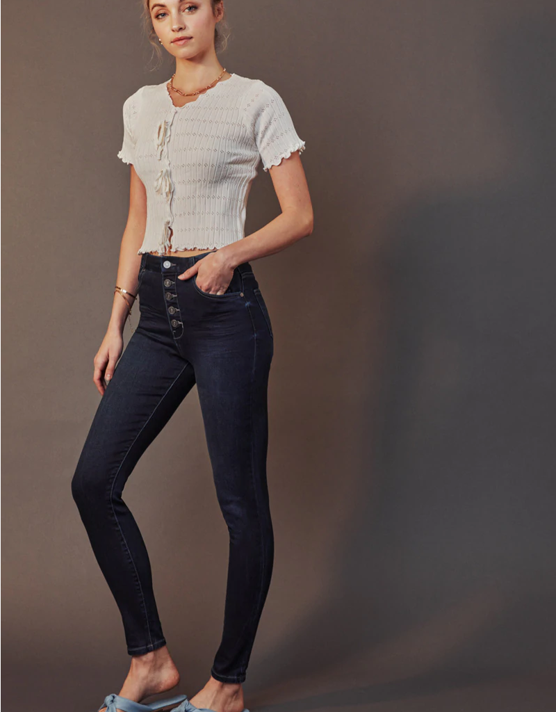 Close up of Kalista High Rise Super Skinny jeans showing the button closure and denim texture