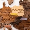 Miniature colorful sticker flags applied to a world map board