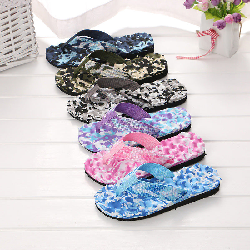 Women's black platform EVA flip-flop sandals with a comfortable sole, shown in a beach setting.