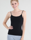 Model wearing a minimalist spaghetti strap short length camisole in a versatile, form-fitting nylon spandex blend.