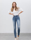 Close up of everyday mid-rise ankle skinny jeans featuring premium cotton-stretch denim.