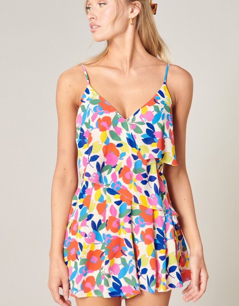 Women's bohemian floral rainbow romper in off-white, bright-orange, hot-pink, bright-blue, and yellow