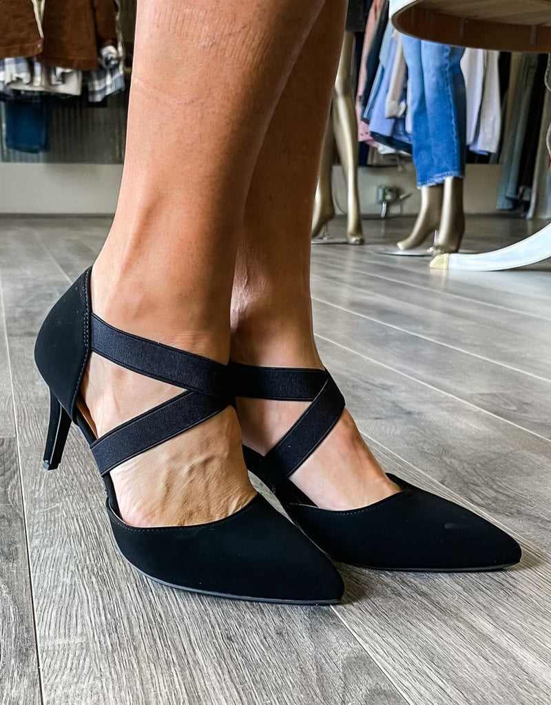 Side profile view of the Missy Heel in black, a classic stiletto high heel