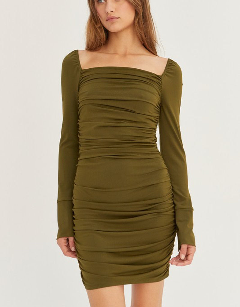 Front view of an olive green ruched bodycon knit mini dress