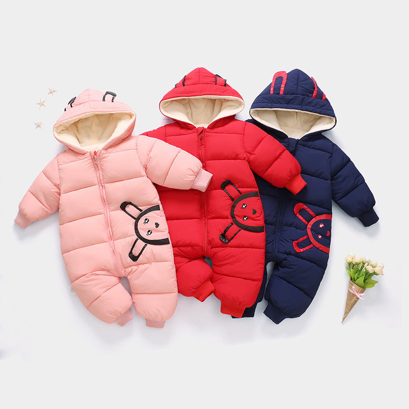 Baby wearing a modern hooded snowsuit with cute bear ears on the hood