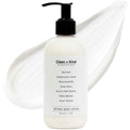 Bottle of Clean + Kind Retinol Body Lotion surrounded by natural ingredient swatches including aloe vera and tallow.