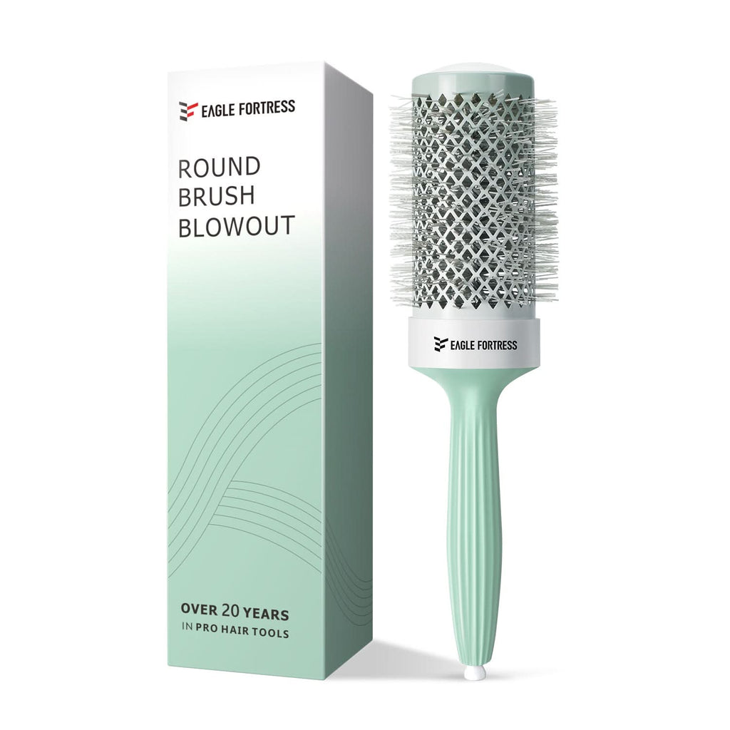 A professional 2.09in round hair brush in pastel mint green and white with a ceramic-coated barrel.