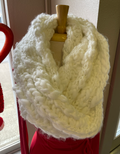 Cozy minimalist white chunky knit infinity scarf worn as a stylish winter accessory