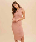 Model wearing a sleeveless rose pink midi sweater dress with a fitted bodycon silhouette