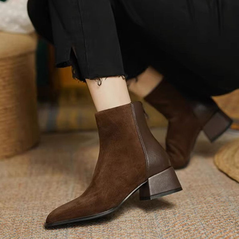 A pair of Women’s Suede Mid-Heel Martin Boots in a stylish ankle-height design