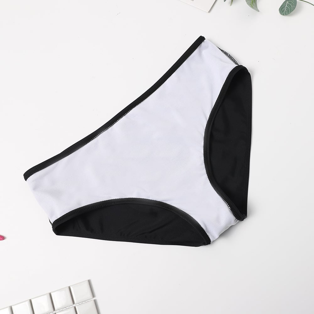 Black and white bikini bottom on a light gray background