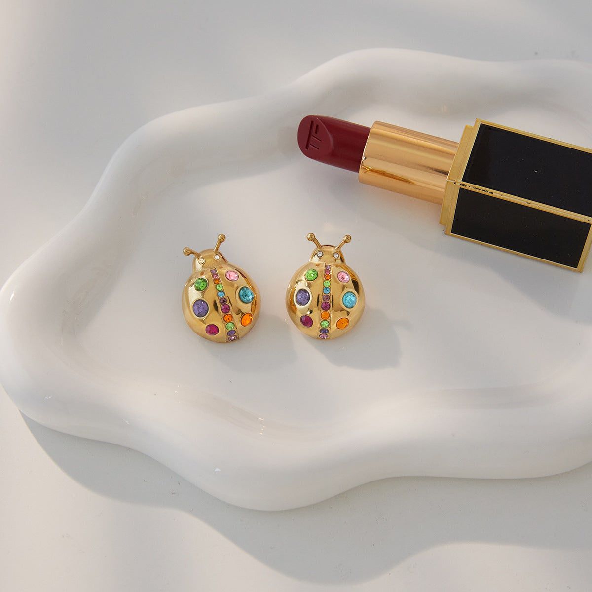 Polished gold stainless steel ladybug stud earrings with colorful zircon stones