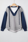 Front and back view of the Zariyah colorblock hoodie featuring gray body, navy sleeves, hood, and drawstring detail.