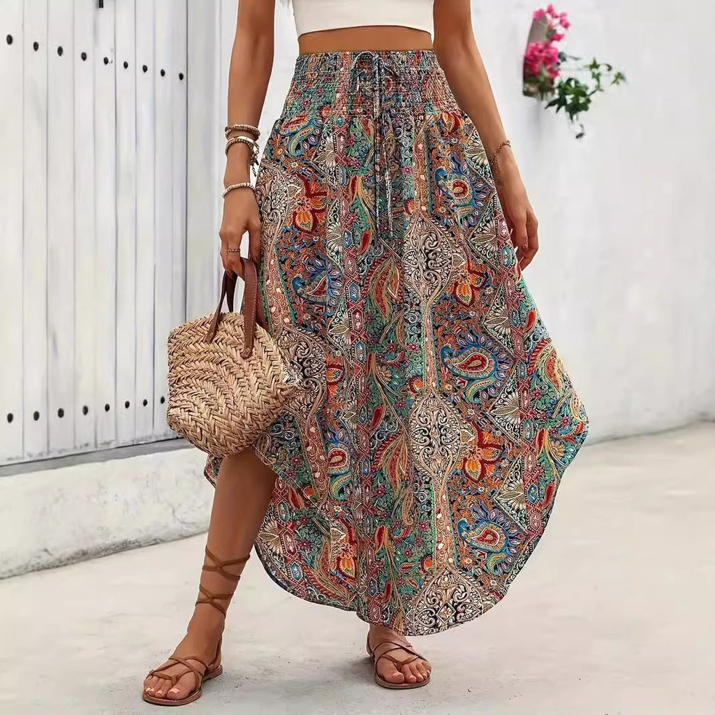 A-line casual skirt featuring a vibrant botanical print of flowers and plants in a flattering silhouette.