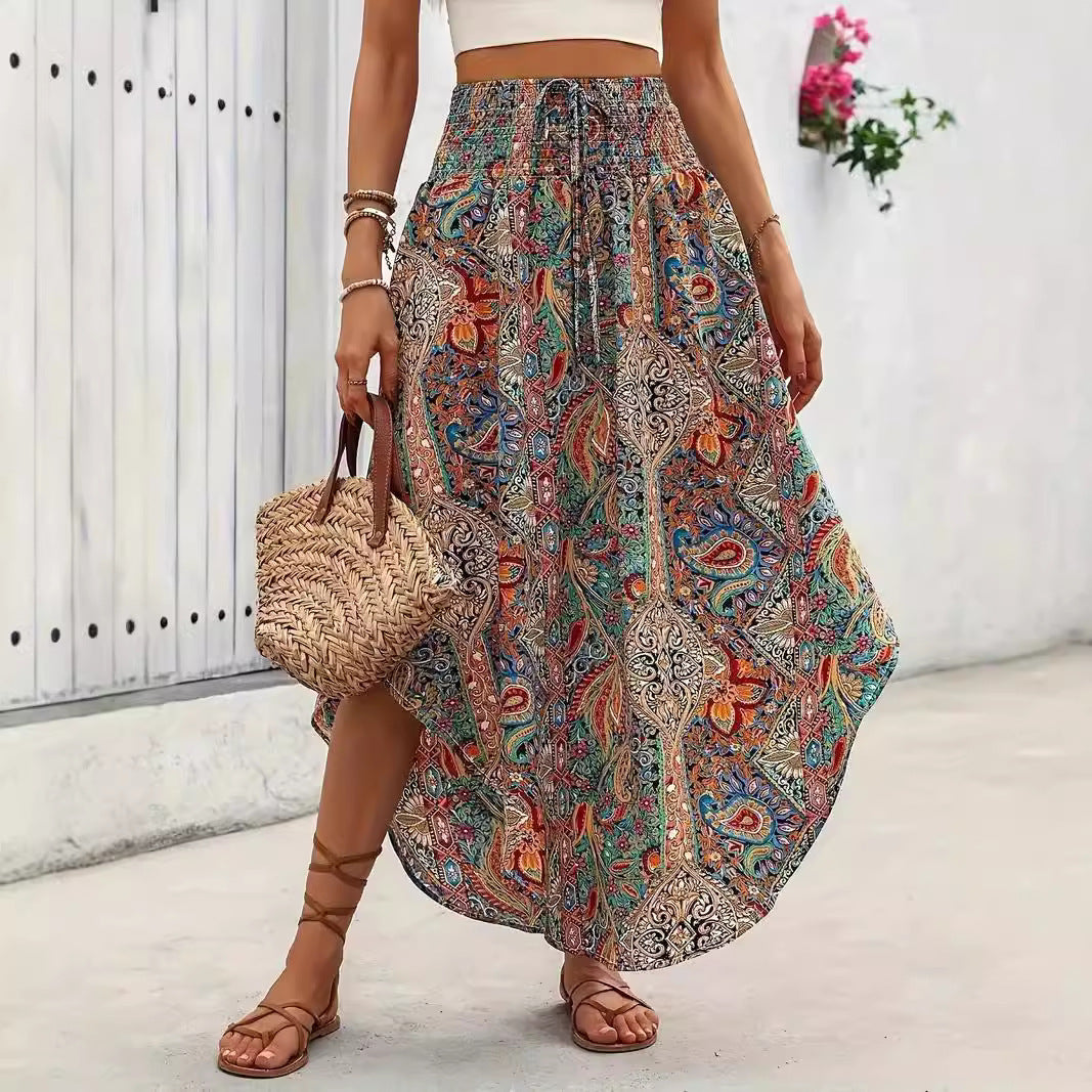 A-line casual skirt featuring a vibrant botanical print of flowers and plants in a flattering silhouette.