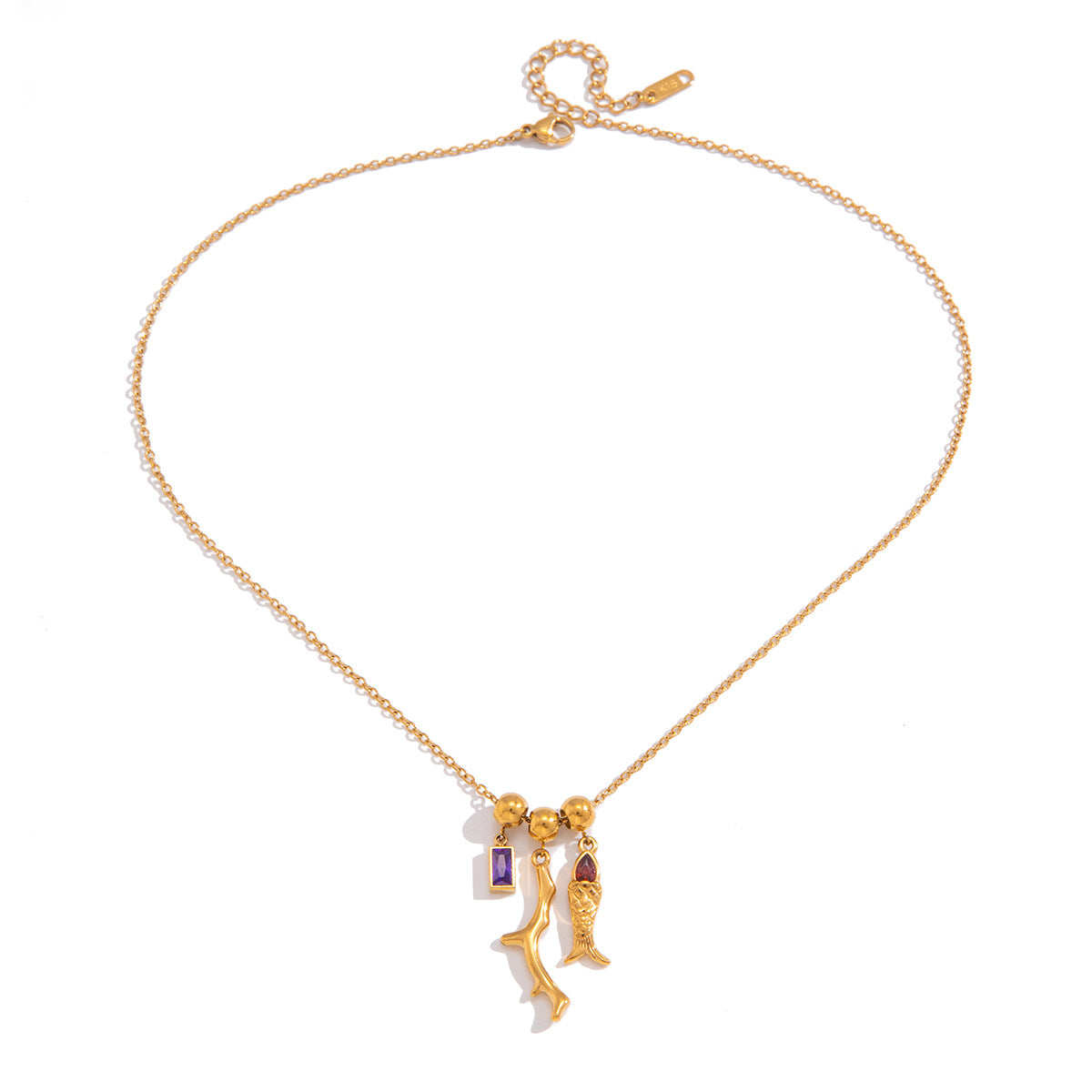 Gold fish pendant necklace with purple and red zircon accents.