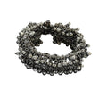 Close-up view of an oxidised silver-plated openable bracelet with hanging ghungroo beads