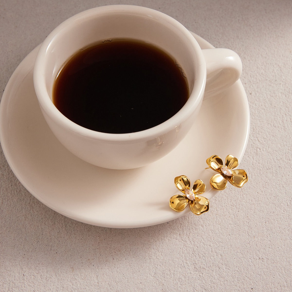 Luxurious 18K gold-plated titanium steel flower stud earrings with central cubic zirconia