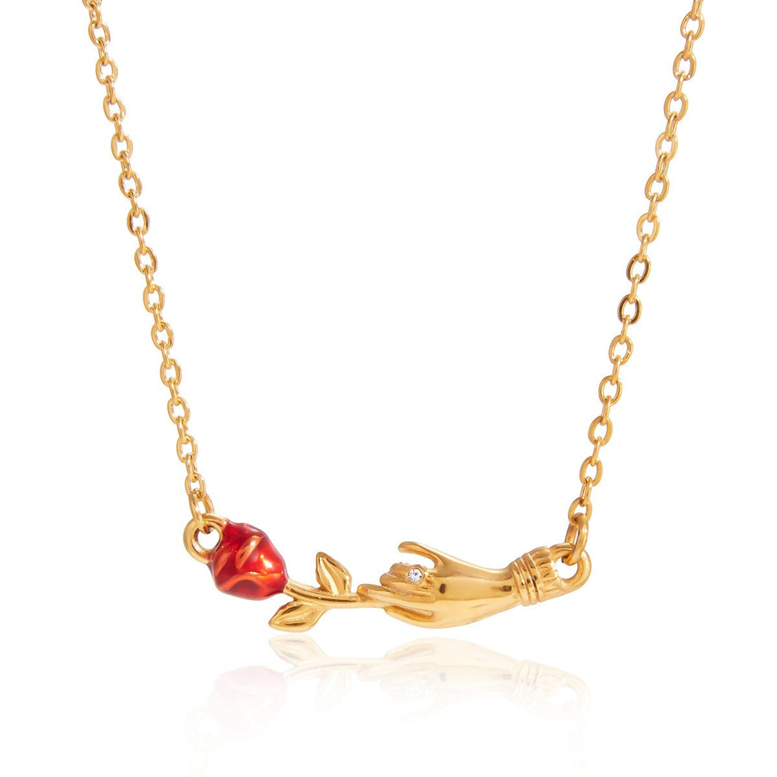 Close-up of an elegant 18K gold rose flower pendant necklace resting on a neutral background.
