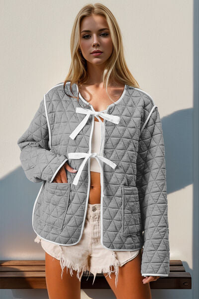 Women's grey and white quilted tie-front jacket with contrast trim and pockets