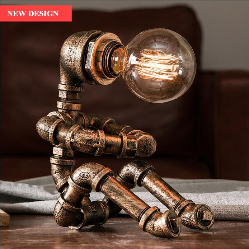 Vintage industrial iron pipe desk lamp in a kettle design with bronze and black finish