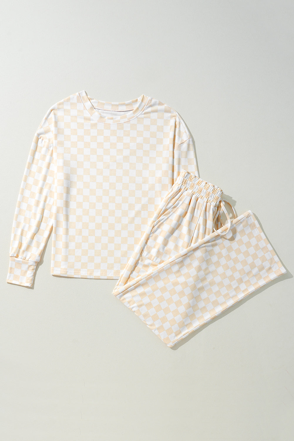 Women wearing a relaxed-fit cream and pale yellow checkered long sleeve lounge set