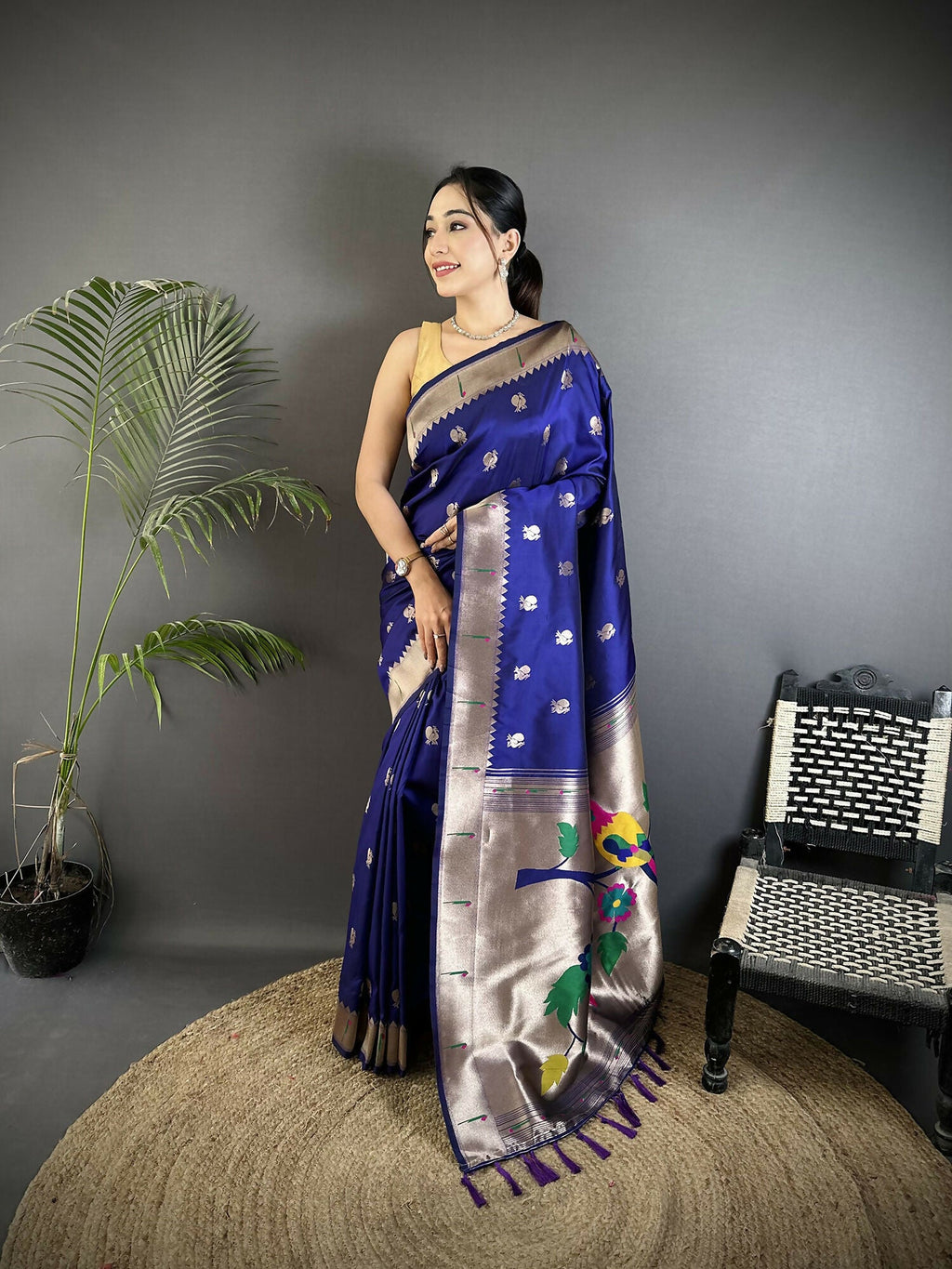 Royal blue soft silk Kanchipuram saree with intricate peacock and floral motifs.