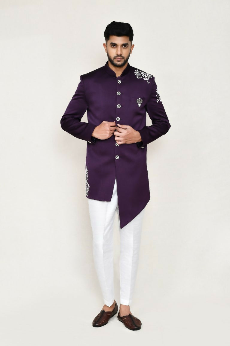 A stylish purple Indo-Western top with thread work paired with white straight-fit pants.