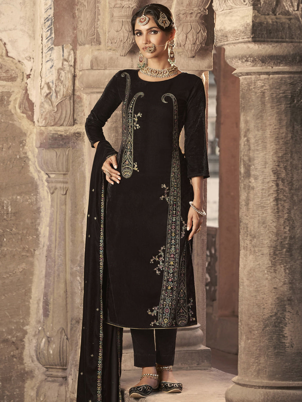Elegant brown velvet straight kurta with floral Resham and Jari embroidery, paired with matching pants and a dupatta.