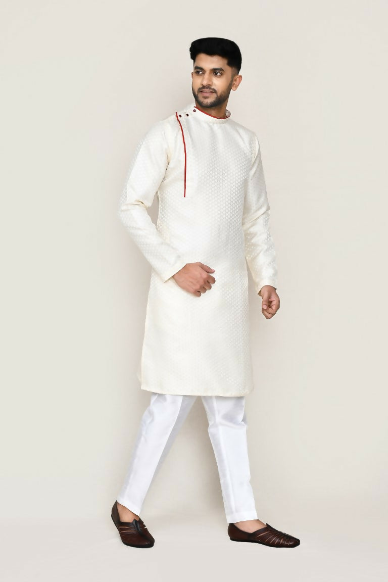 Model wearing a cream jacquard kurta with matching straight fit pants for a festive look