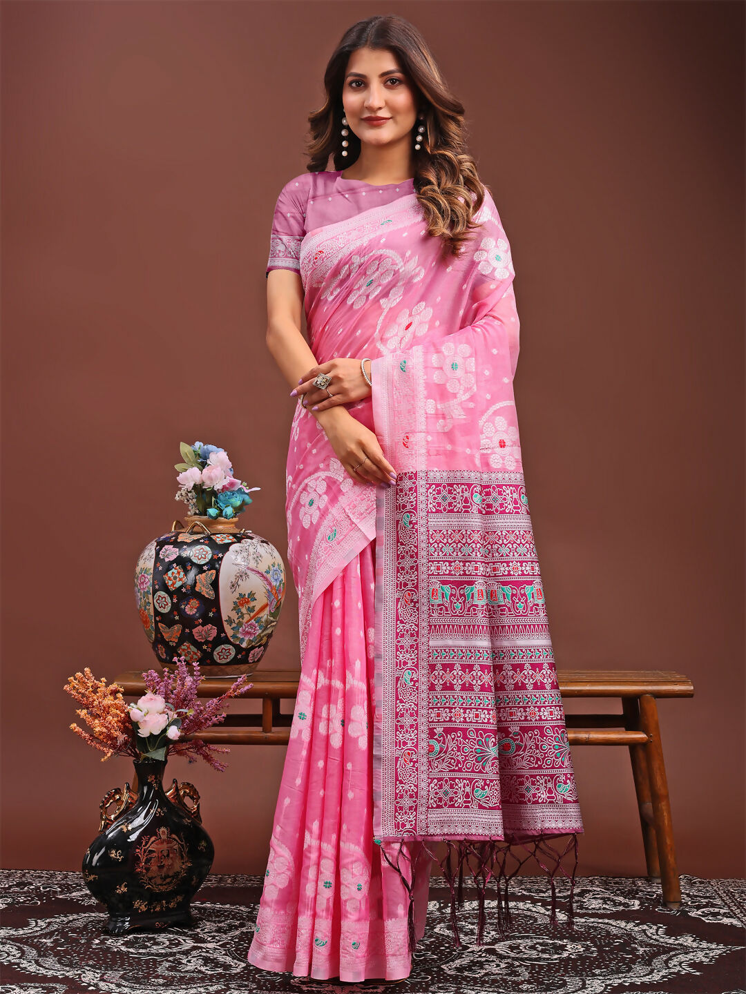 Soft pink linen cotton saree featuring a breathable fabric finish