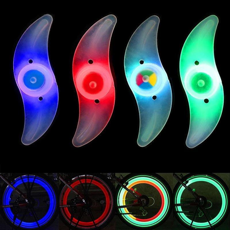 Multi-color LED bike spoke lights mounted on a bicycle wheel, showing bright patterns for night safety.