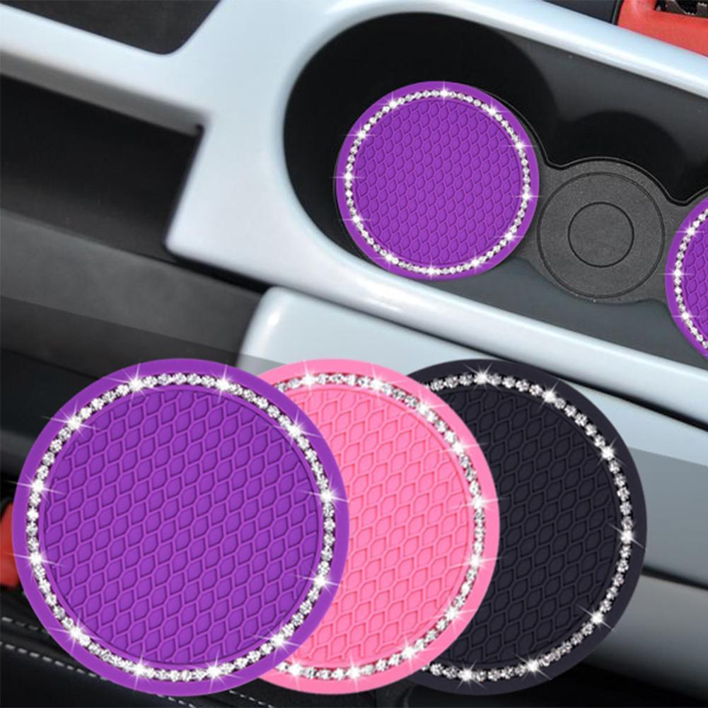Pink rhinestone car cup holder coasters featuring a non-slip PVC design for vehicle interiors.