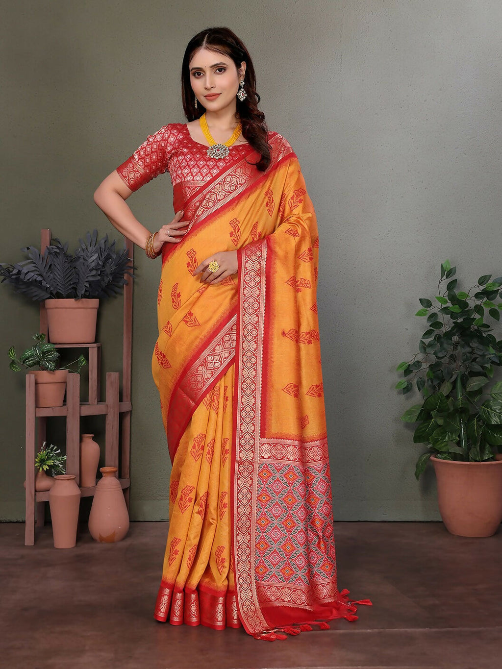 Orange Banarasi silk saree with intricate woven designs and unstitched blouse fabric.