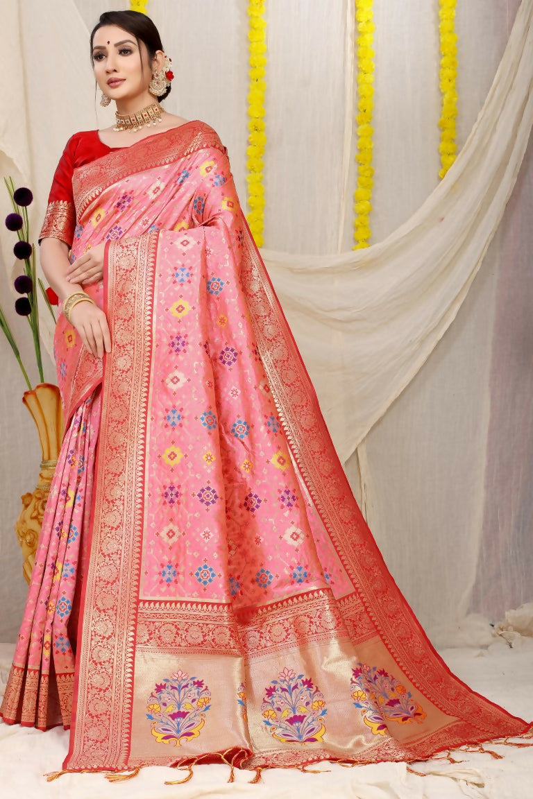Baby Pink Patola Silk saree featuring intricate gold Zari woven patterns with a solid red blouse.