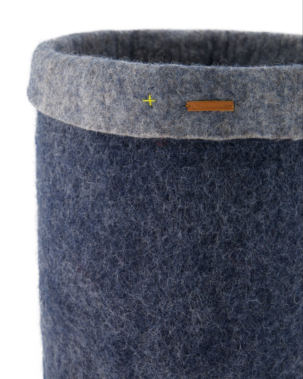 Blue felted storage basket with a gray rim on a white background