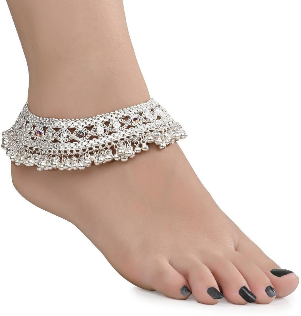 Close-up of a silver plated white metal traditional payal with a detailed matte finish.