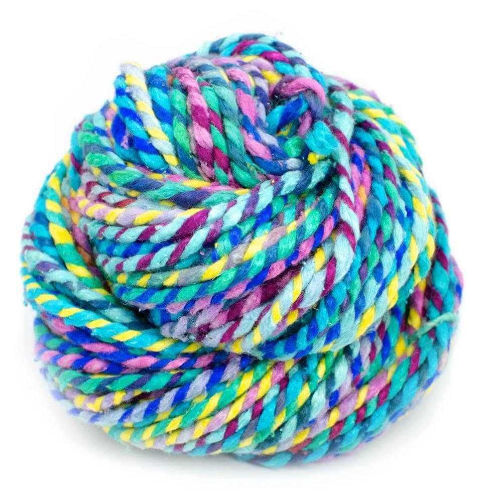 Close-up of vibrant multicolored recycled silk worsted weight yarn in shades of green, blue, pink, and turquoise.