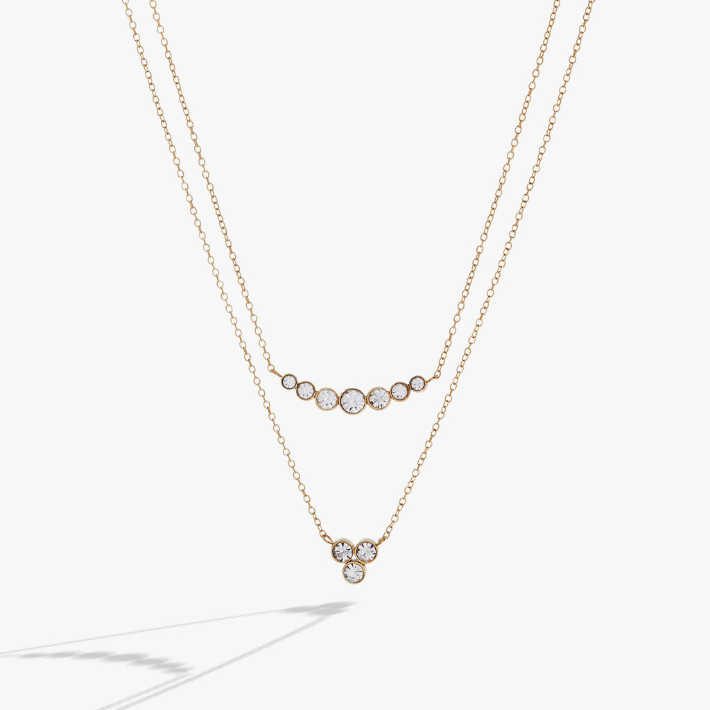 Double-layer crystal necklace with graduated stone sizes and adjustable clasp.