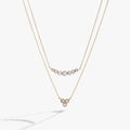 Double-layer crystal necklace with graduated stone sizes and adjustable clasp.