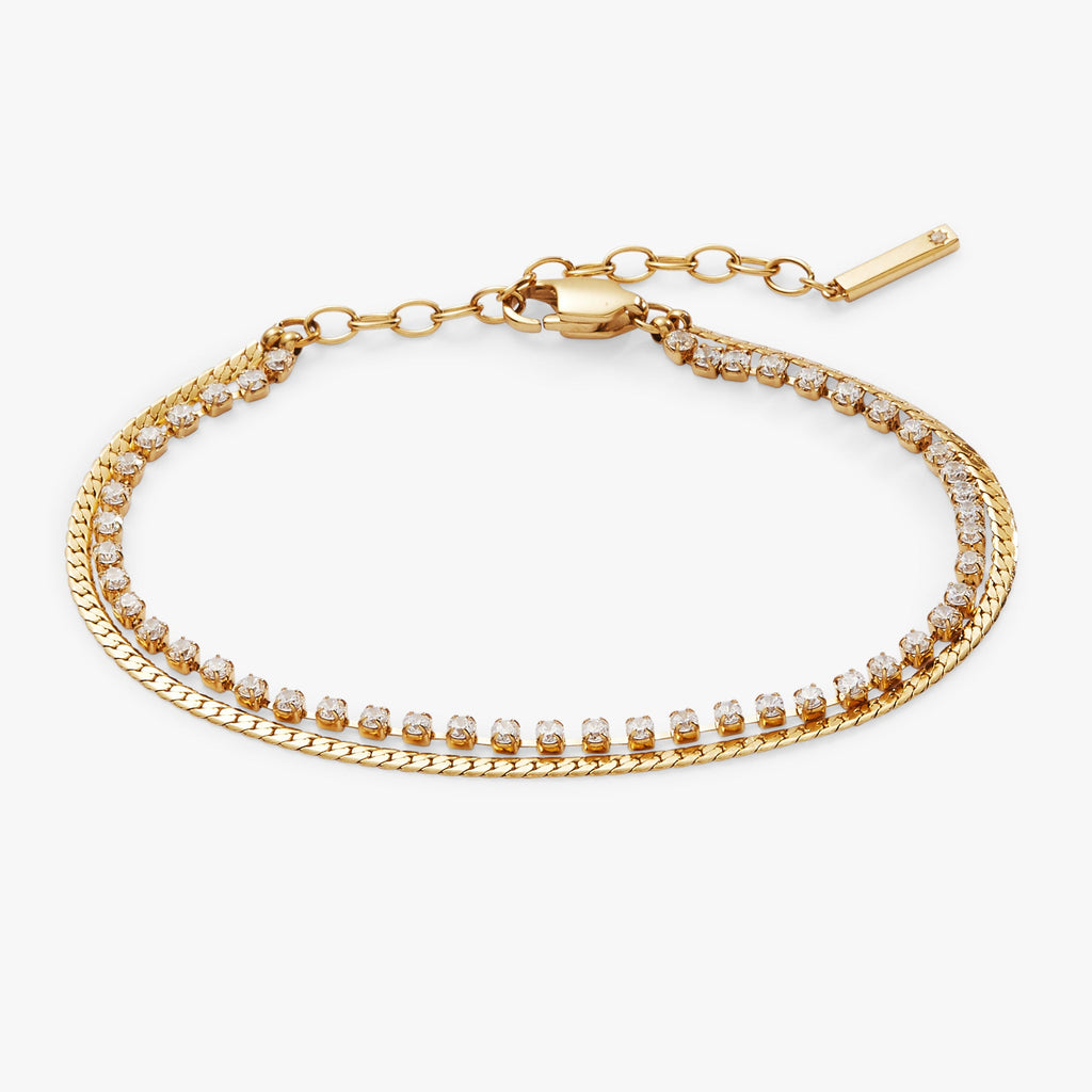 Double strand tennis bracelet with clear crystals and textured gold/silver finish on an adjustable chain.