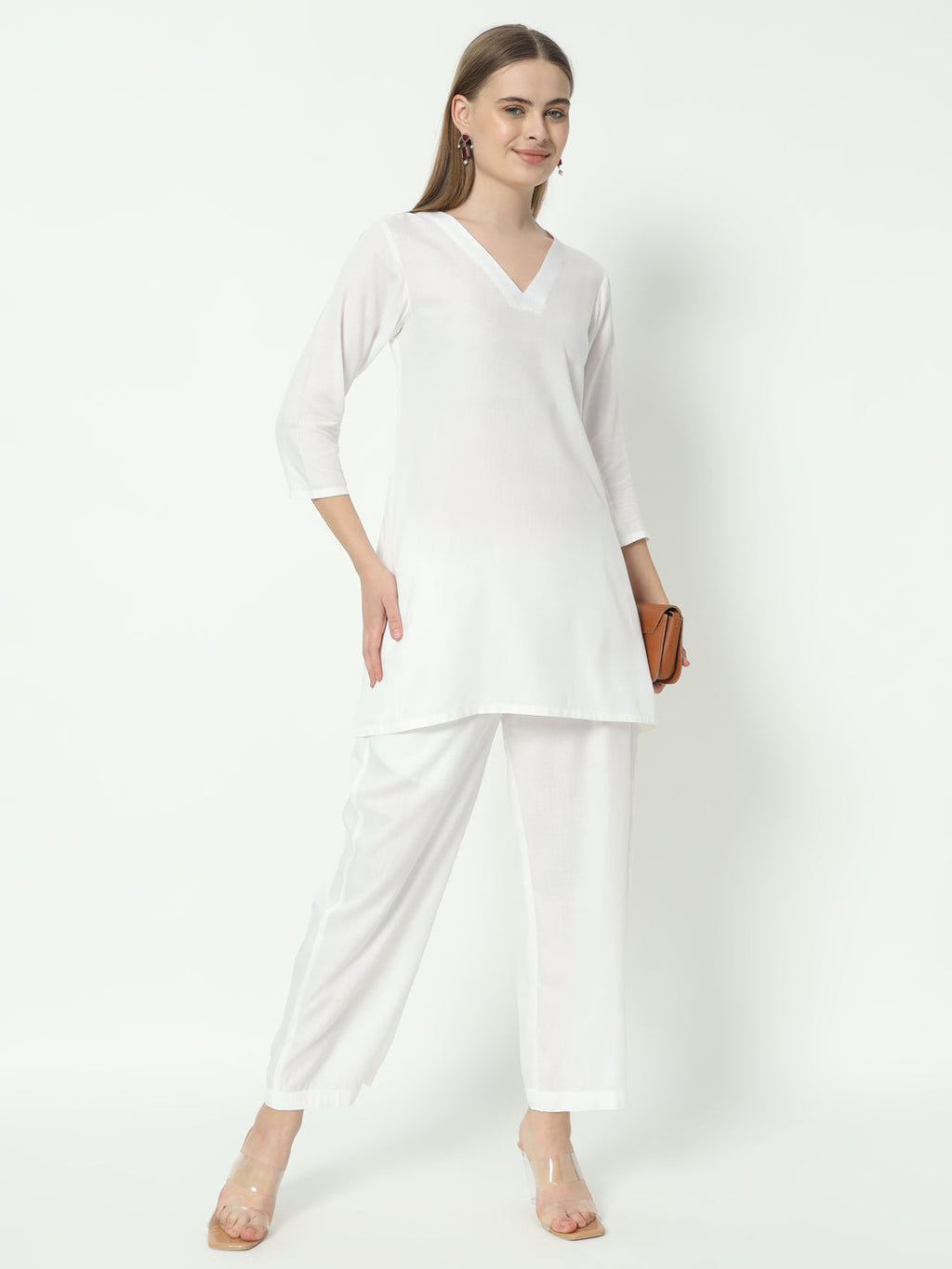 A woman wearing a white pure cotton V-neck co-ord set with a relaxed fit