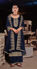 Close-up of premium blue velvet fabric with intricate sequence embroidery for salwar suit
