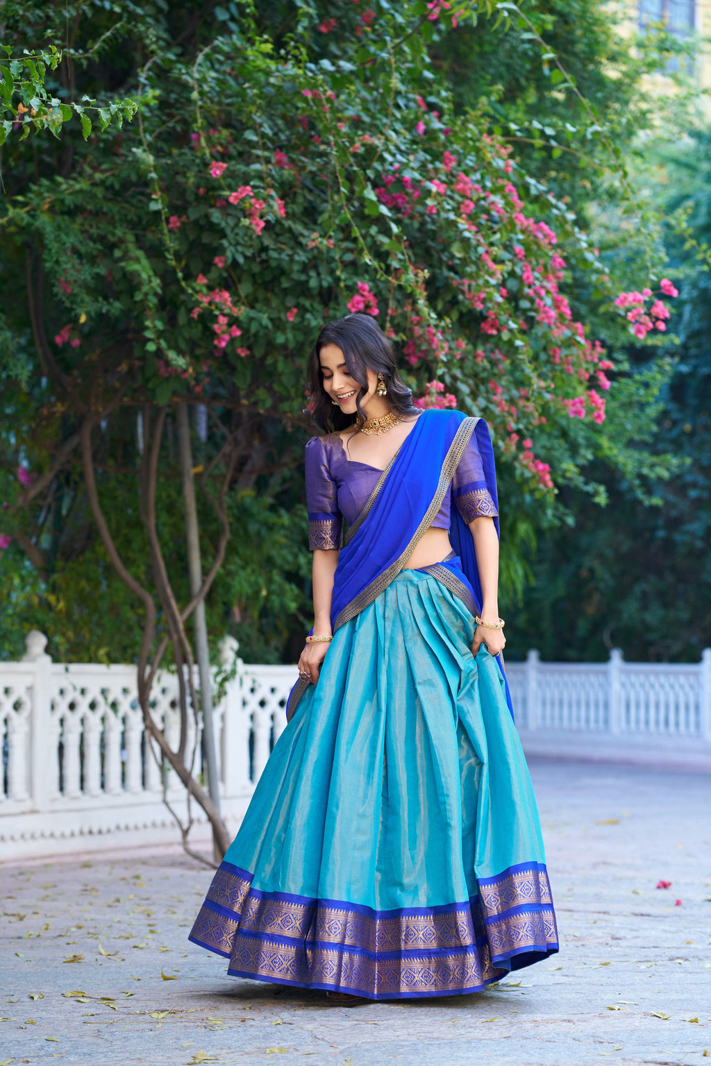 Royal blue Kanchipuram silk lehenga choli with ornate gold zari weaving and dupatta