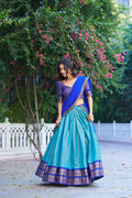 Royal blue Kanchipuram silk lehenga choli with ornate gold zari weaving and dupatta