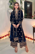 Close up of blue velvet salwar suit fabric with intricate embroidery and sequence work