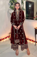 Close up of maroon velvet fabric with gold embroidery and sequence work for salwar suit